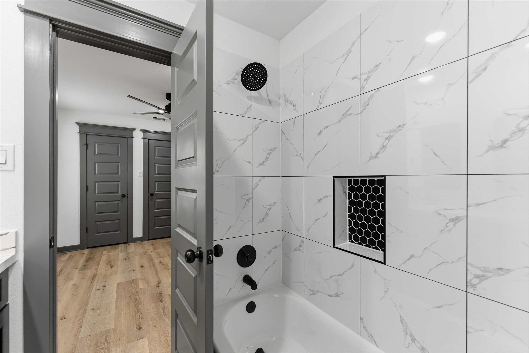 8006 Birmingham Street, Unit A/B Houston, TX 77028 - Photo 18 of 24 a bathroom with a bathtub and shower