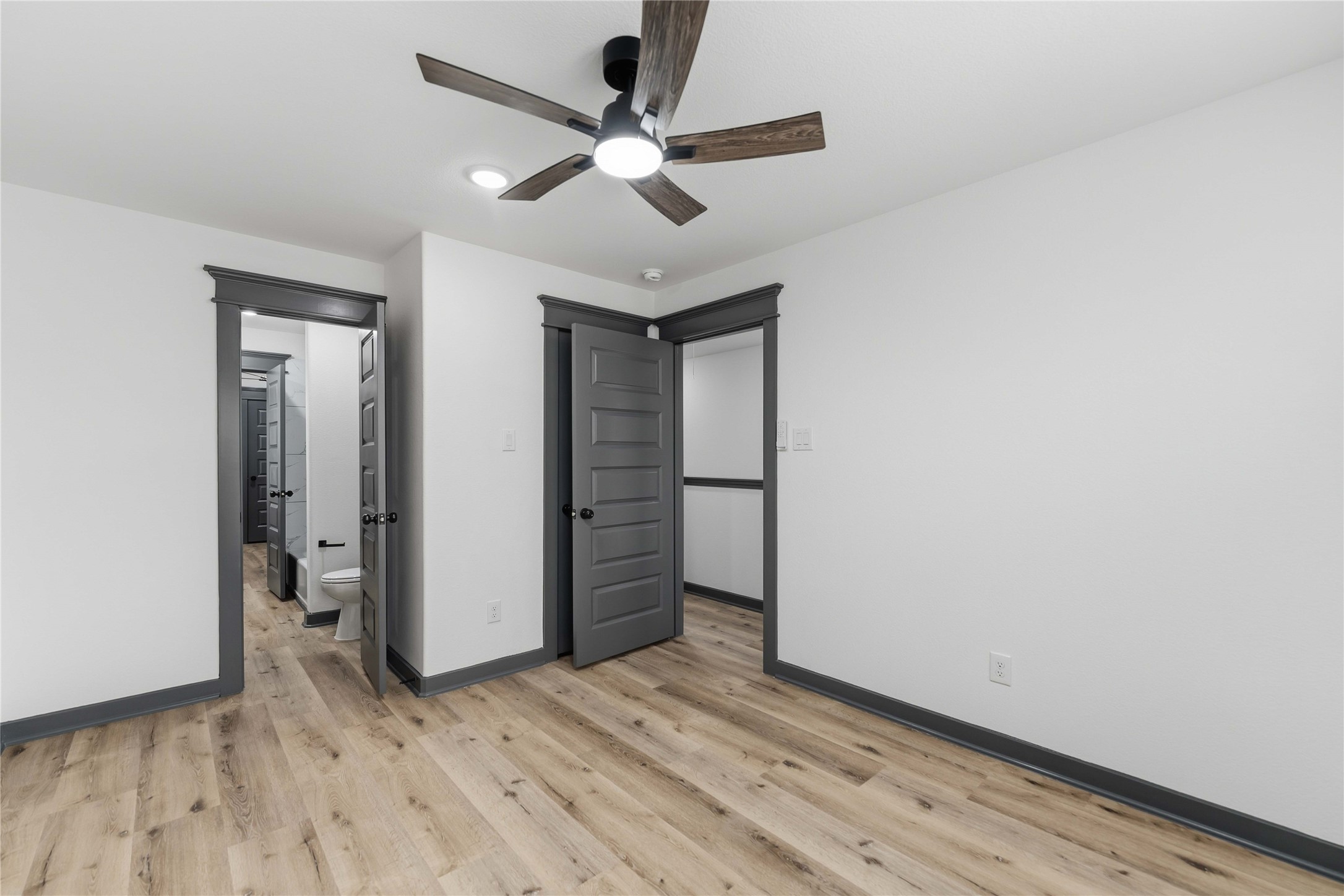 8006 Birmingham Street, Unit A/B Houston, TX 77028 - Photo 19 of 24 wooden floor in an empty room with a window