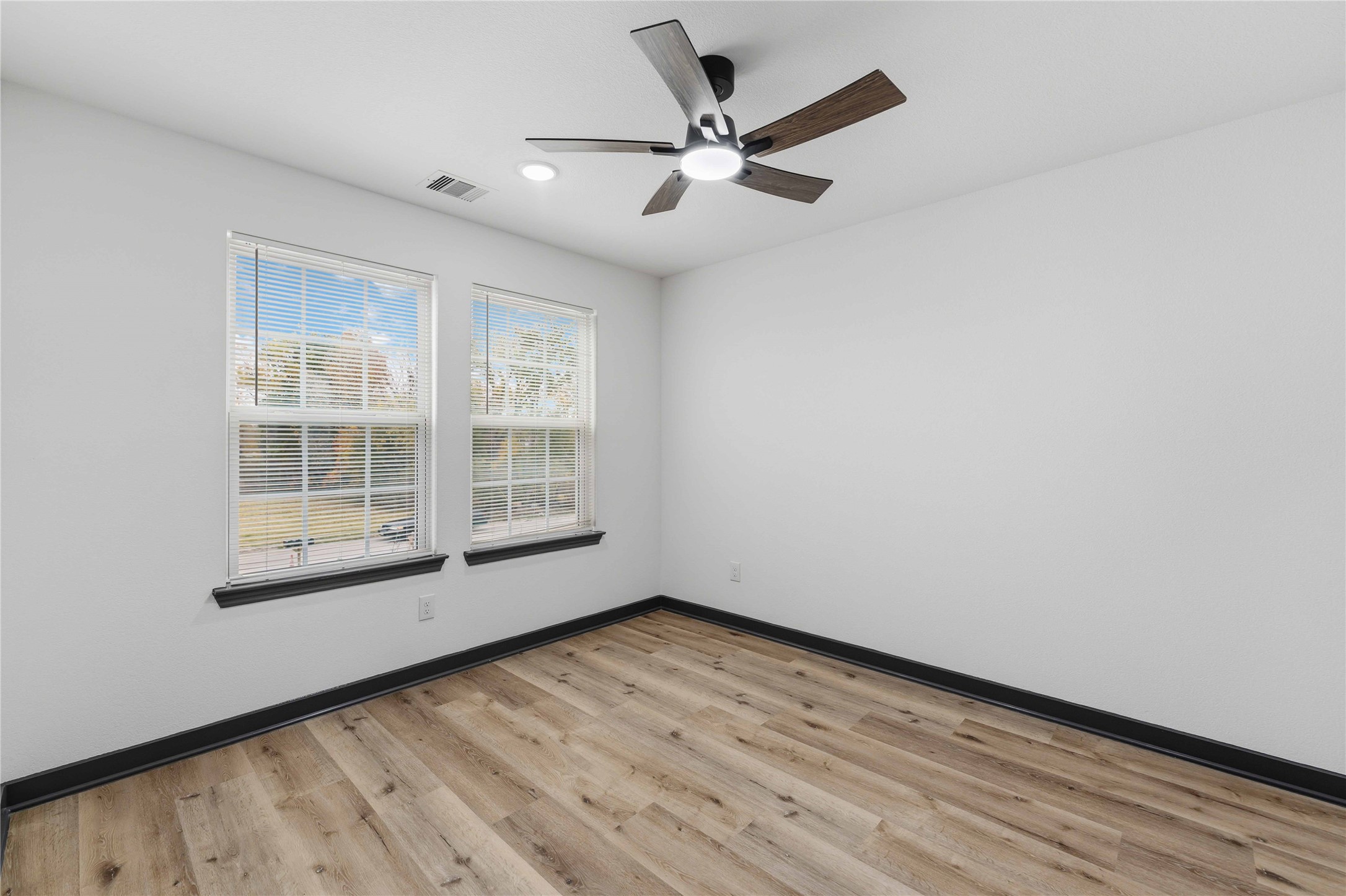 8006 Birmingham Street, Unit A/B Houston, TX 77028 - Photo 20 of 24 wooden floor in an empty room with a window