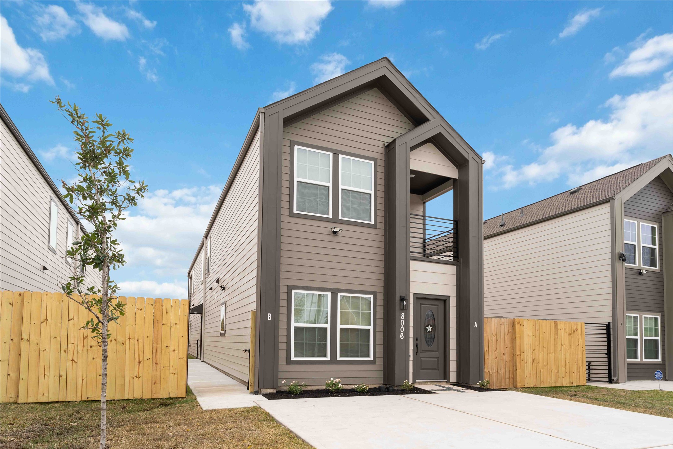 8006 Birmingham Street, Unit A/B Houston, TX 77028 - Photo 2 of 24 a front view of a house with a garage