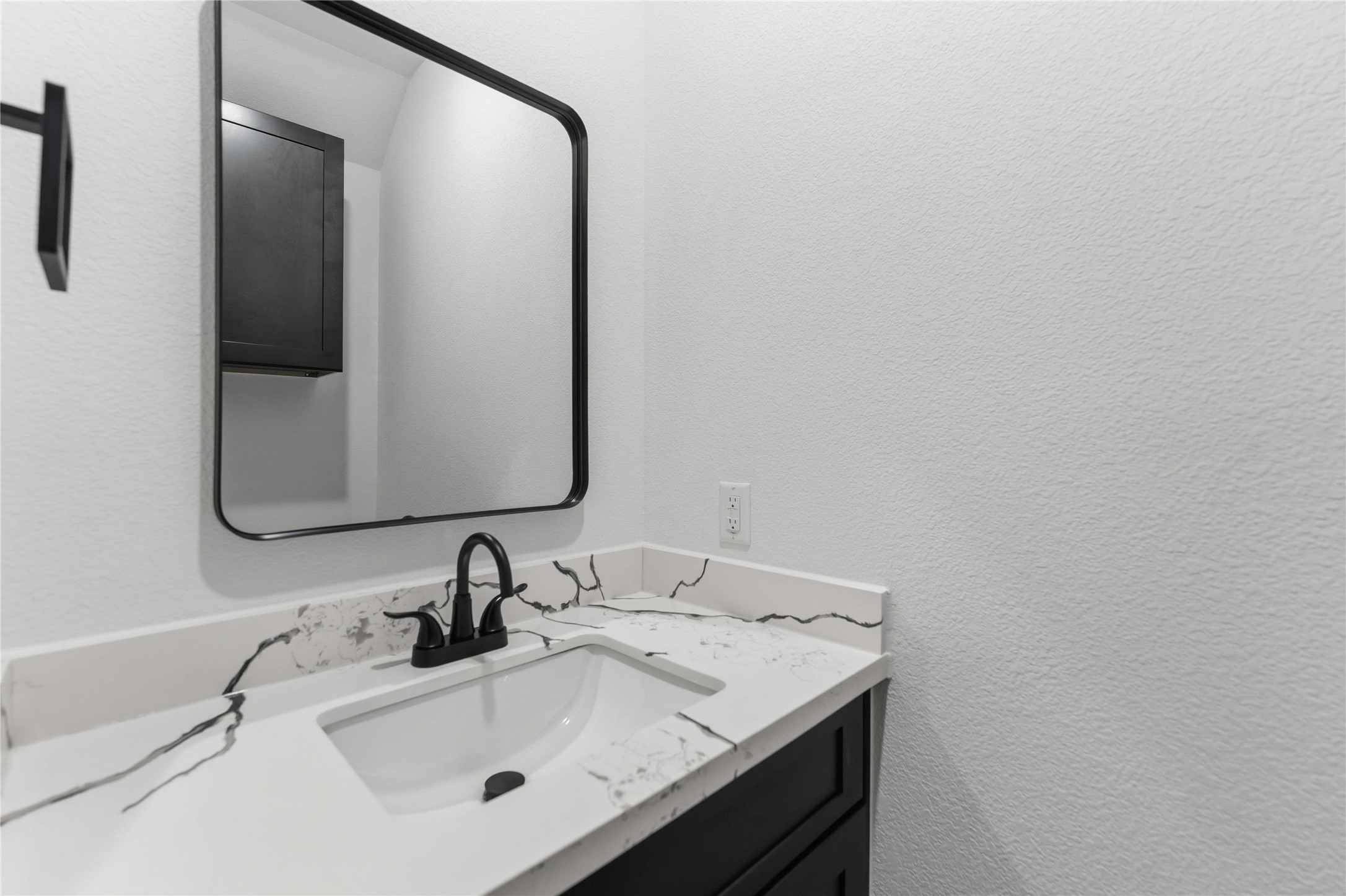 8006 Birmingham Street, Unit A/B Houston, TX 77028 - Photo 21 of 24 a bathroom with a sink and a mirror