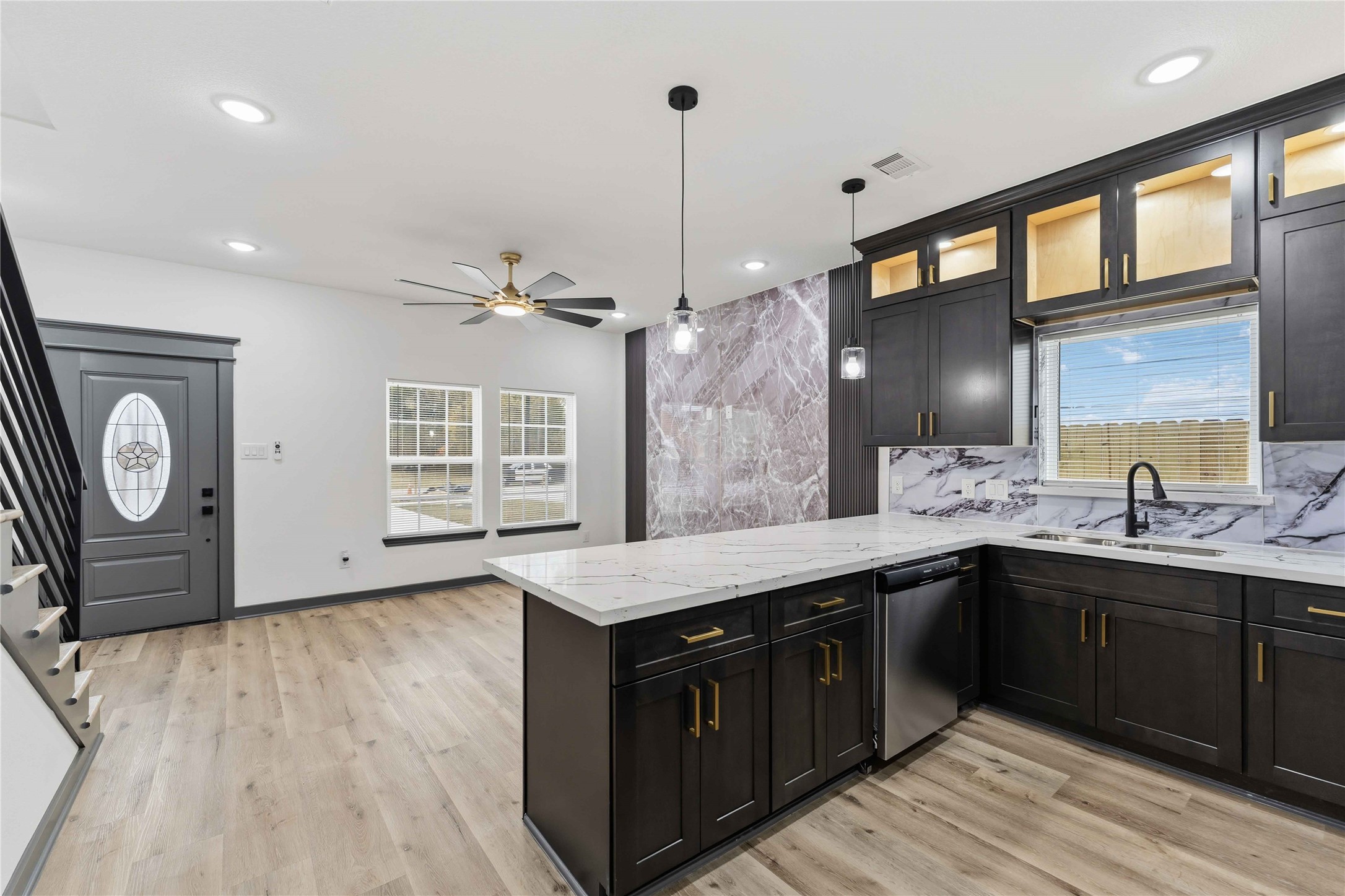 8006 Birmingham Street, Unit A/B Houston, TX 77028 - Photo 3 of 24 a kitchen with a sink a stove cabinets and wooden floor