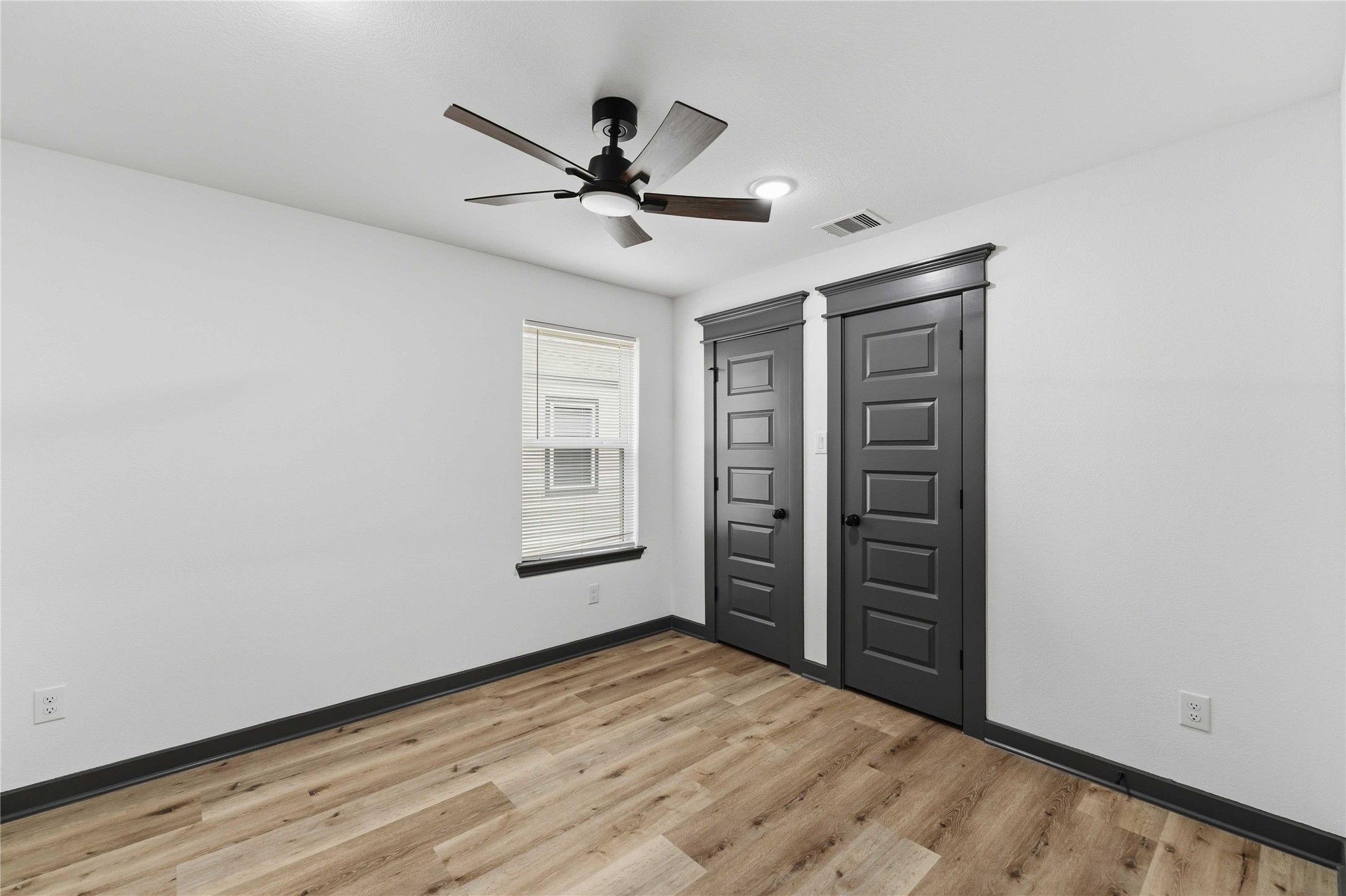 8006 Birmingham Street, Unit A/B Houston, TX 77028 - Photo 9 of 24 a view of a livingroom with a ceiling fan and hardwood floor
