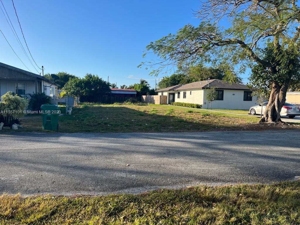 12120 Southwest 219th Street Miami, FL 33170 - Photo 1 of 1 a front view of a house with a garden