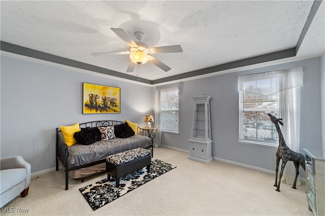 4461 Sexton Road Cleveland, OH 44105 - Photo 26 of 47 Carpeted bedroom with ceiling fan and a textured ceiling