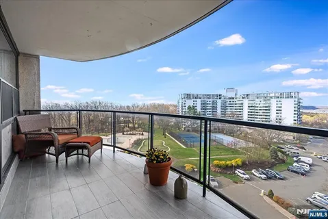 a view of a balcony with chairs