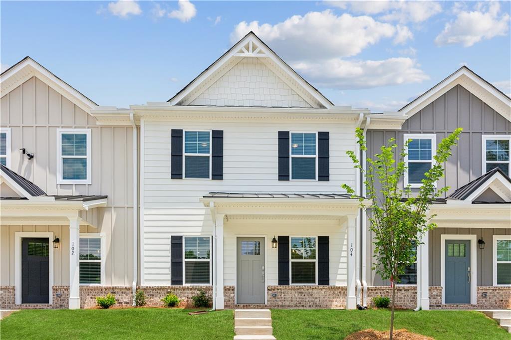 165 Mill Center Boulevard, Unit 104 Athens, GA 30606 - Photo 1 of 1 a view of a house with a yard