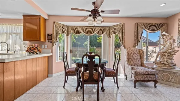 a dining room with furniture and window