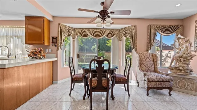 a dining room with furniture and window