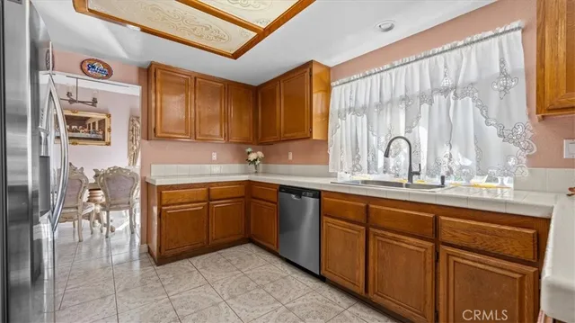 a kitchen with sink cabinets and window