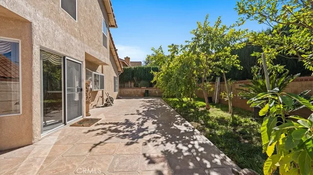 a view of a backyard of the house