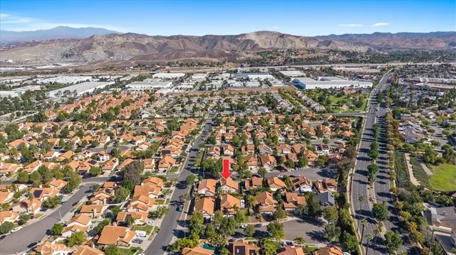 an aerial view of residential house and sandy dunes