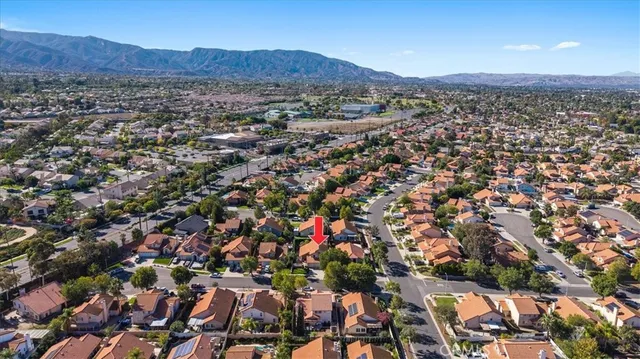 an aerial view of residential house and sandy dunes