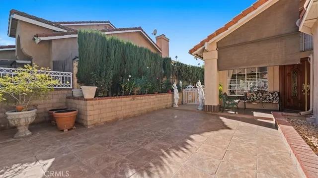 a backyard of a house with outdoor seating
