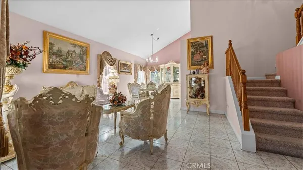 a view of a living room and entryway