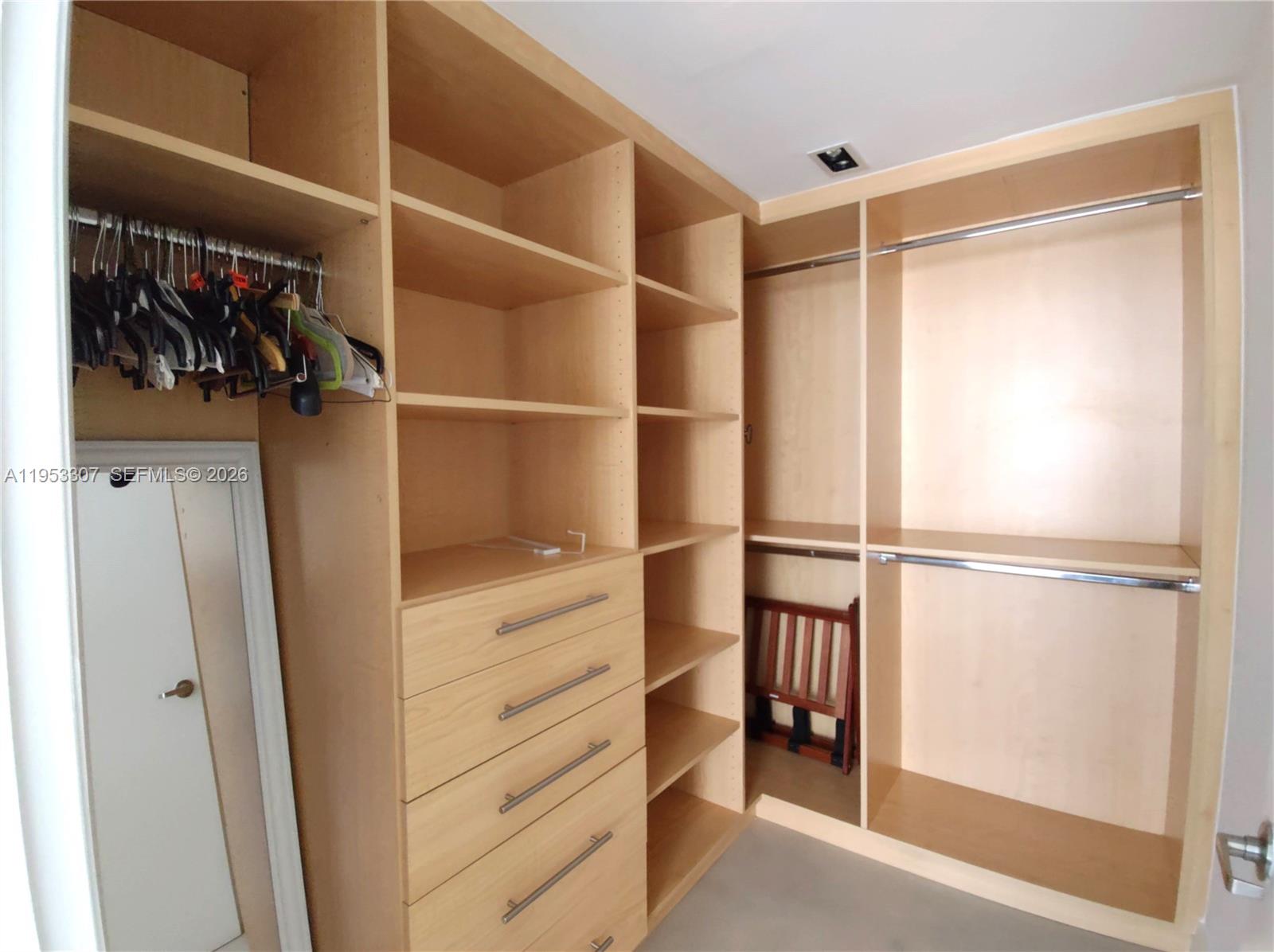465 Brickell Avenue, Unit 4402 Miami, FL 33131 - Photo 16 of 33 a view of walk in closet with empty racks