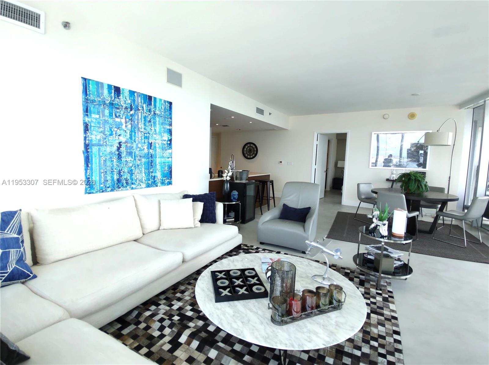 465 Brickell Avenue, Unit 4402 Miami, FL 33131 - Photo 6 of 33 a living room with furniture and a wooden floor