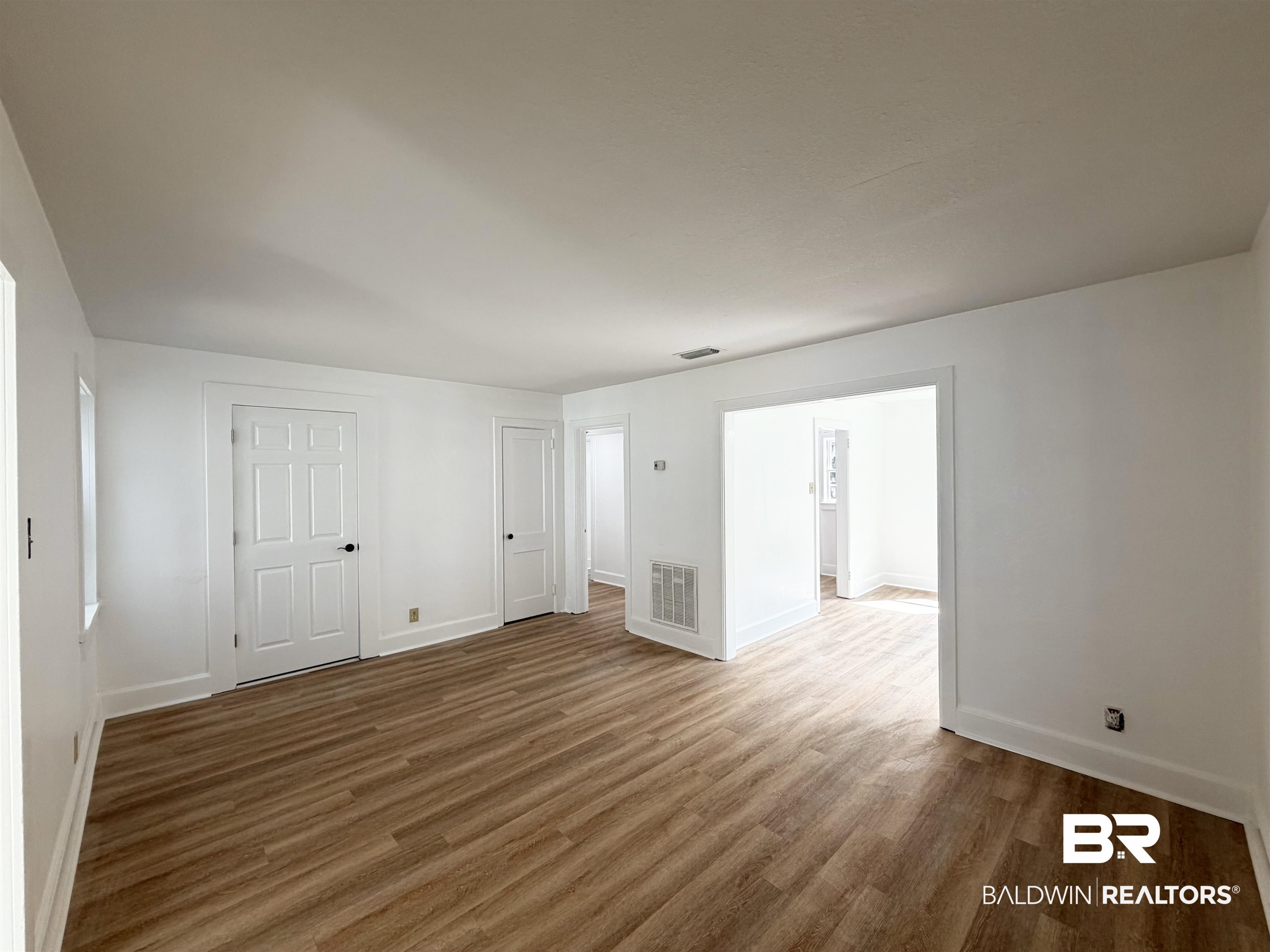 606 Shady Oak Drive Mobile, AL 36608 - Photo 10 of 14 Unfurnished room with wood finished floors and baseboards