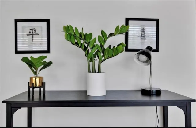 a view of a dining room with furniture and chandelier