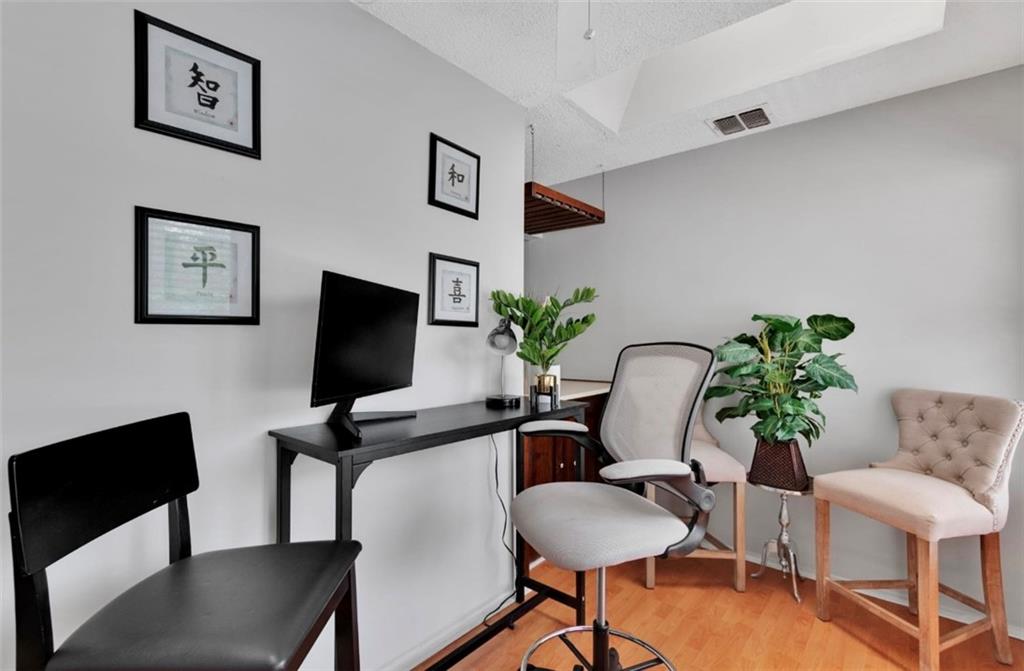 2411 Huntingdon, Unit 2411 Atlanta, GA 30350 - Photo 14 of 45 a view of a livingroom with furniture and a potted plant