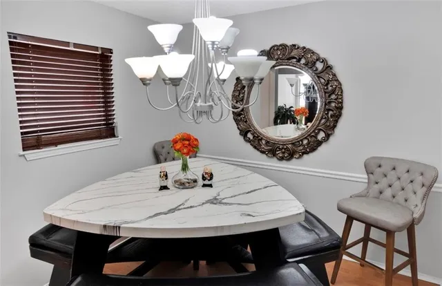 a bathroom with a sink vanity mirror and toilet