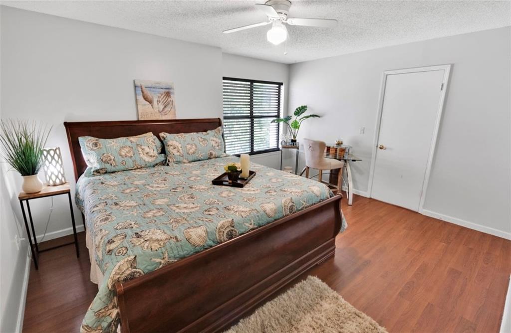 2411 Huntingdon, Unit 2411 Atlanta, GA 30350 - Photo 22 of 45 a bed sitting in a bedroom next to a window