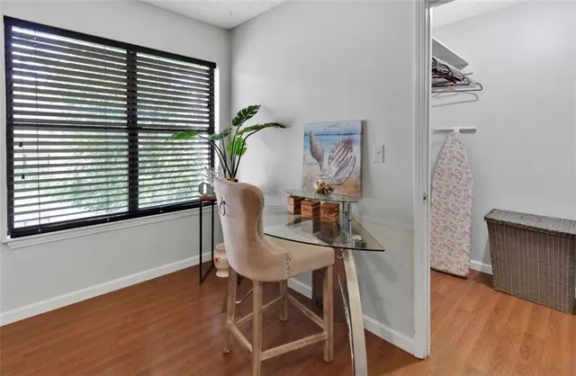 a bedroom with a bed and a mirror