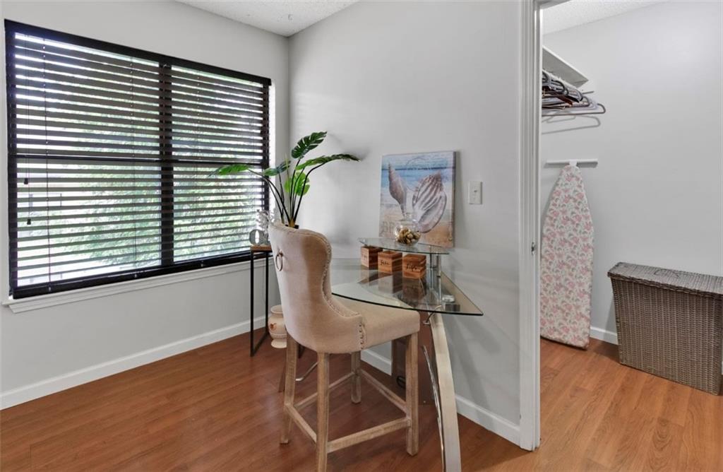 2411 Huntingdon, Unit 2411 Atlanta, GA 30350 - Photo 23 of 45 a view of a workspace with furniture and a window