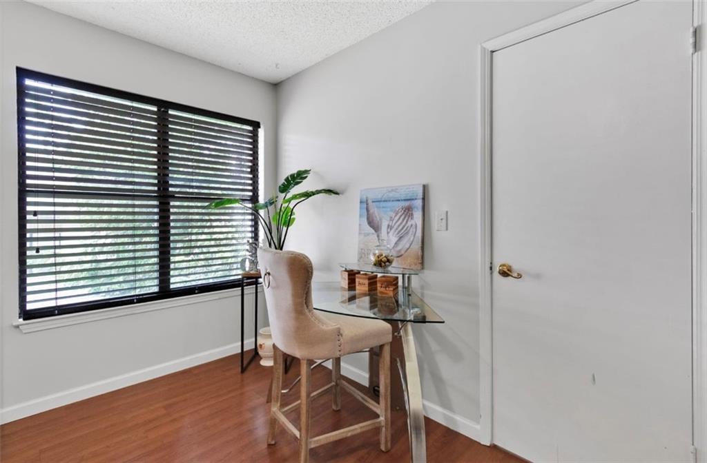 2411 Huntingdon, Unit 2411 Atlanta, GA 30350 - Photo 24 of 45 a view of a room that has a window and wooden floor