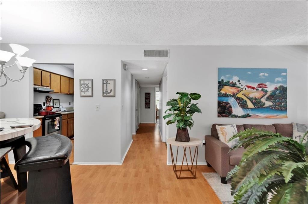 2411 Huntingdon, Unit 2411 Atlanta, GA 30350 - Photo 33 of 45 a view of a livingroom with furniture and a potted plant