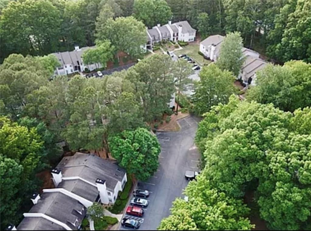 2411 Huntingdon, Unit 2411 Atlanta, GA 30350 - Photo 37 of 45 an aerial view of a house with a yard and outdoor seating