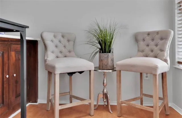 a view of a livingroom with furniture and a potted plant