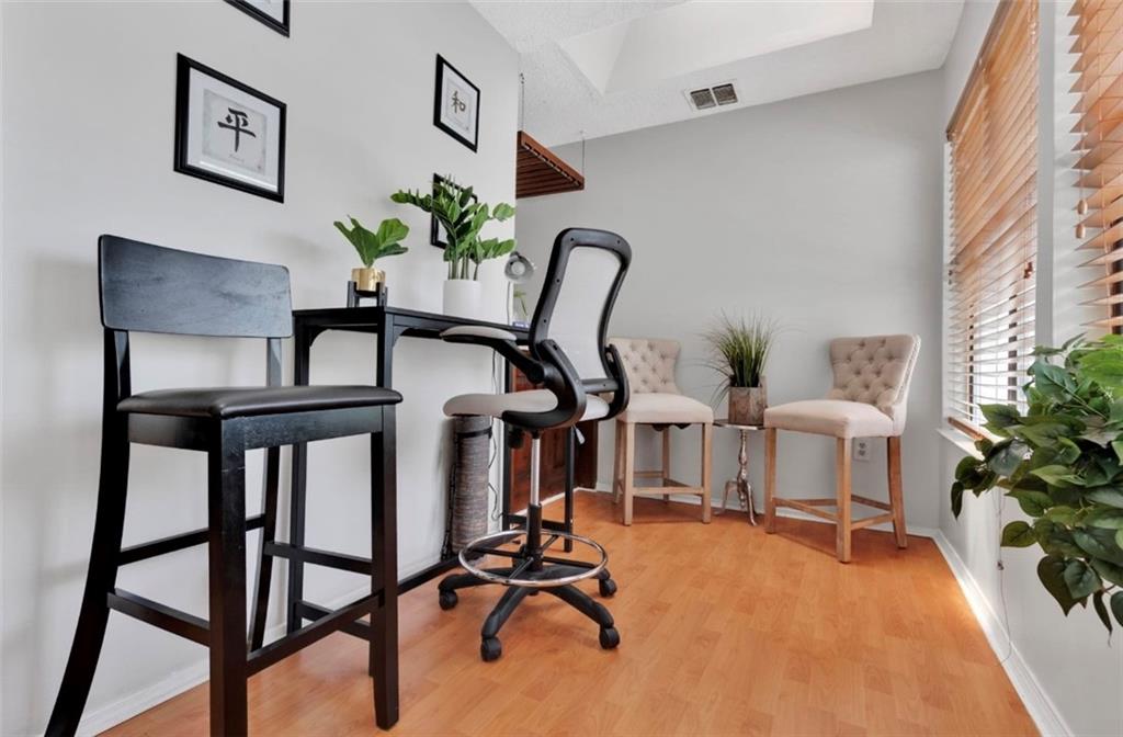 2411 Huntingdon, Unit 2411 Atlanta, GA 30350 - Photo 6 of 45 a view of a livingroom with furniture and a potted plant