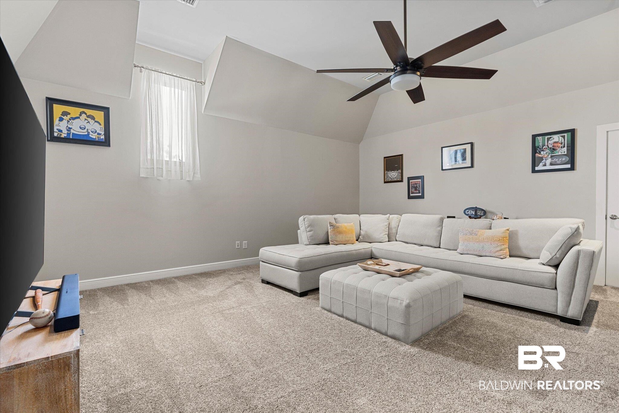 3400 Rue Royal Mobile, AL 36693 - Photo 21 of 33 Living room featuring carpet floors, ceiling fan, and lofted ceiling