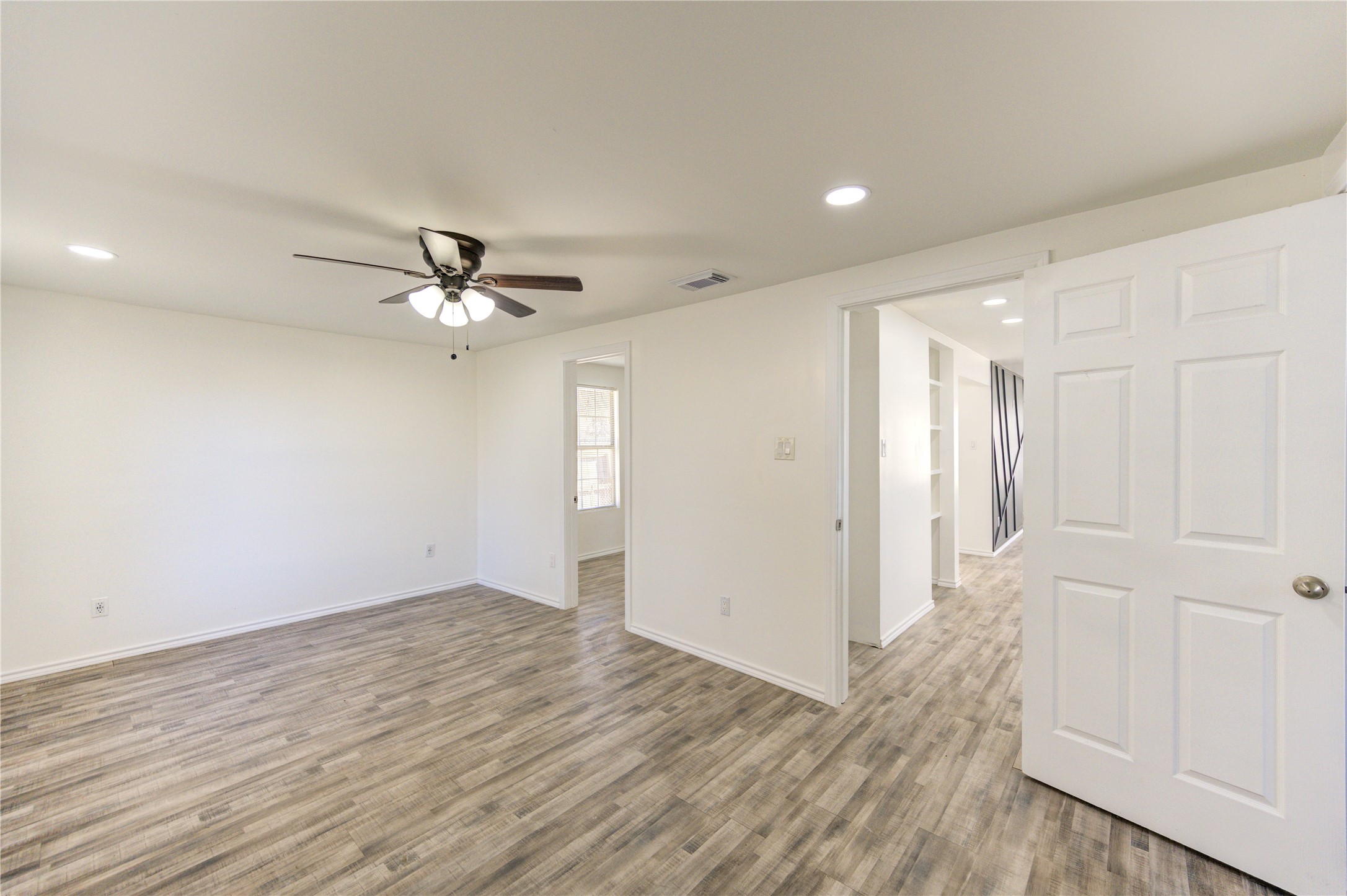 7811 St Louis Street Houston, TX 77028 - Photo 25 of 43 a view of an empty room with wooden floor