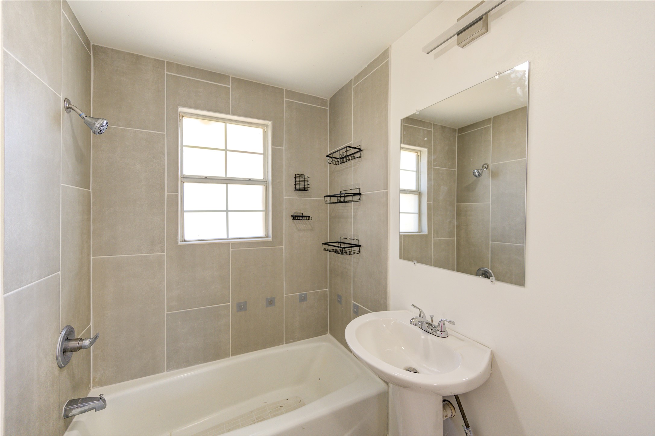 7811 St Louis Street Houston, TX 77028 - Photo 38 of 43 a bathroom with a sink bathtub and shower