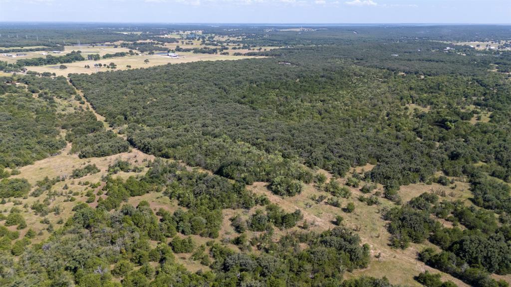 1957 Prairie Grove Road Valley View, TX 76272 - Photo 17 of 28 an aerial view of residential houses with outdoor space and trees