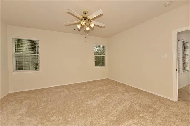 en empty room with windows