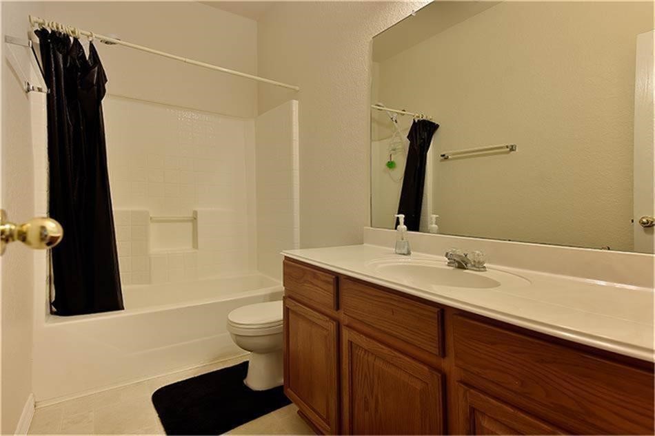 263 Adobe Terrace South Conroe, TX 77316 - Photo 19 of 23 a bathroom with a sink and a mirror