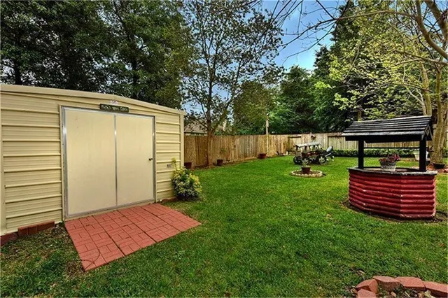 a view of a backyard with sitting area