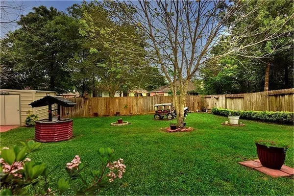 a view of backyard with seating and green space