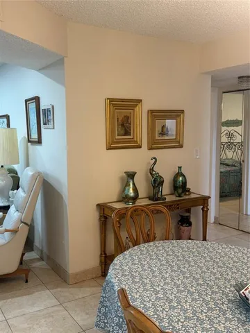 a living room with furniture a couch and wooden floor