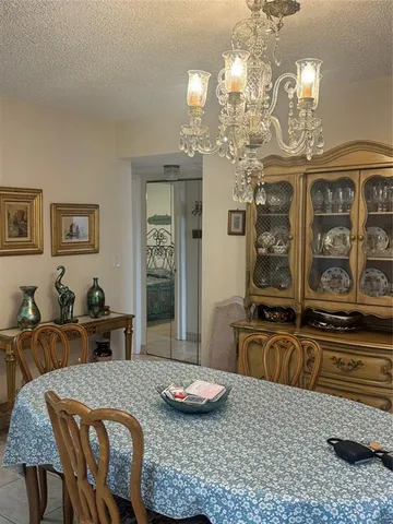 a large kitchen with furniture and window