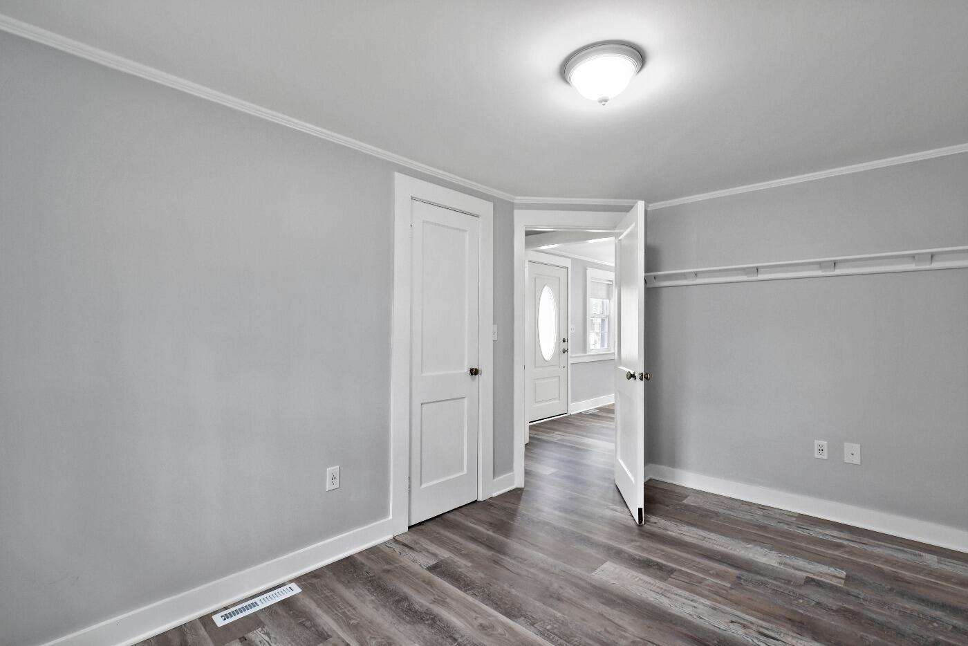 1 Gilbert Road Dennis Port, MA 02639 - Photo 18 of 27 an empty room with wooden floor and windows