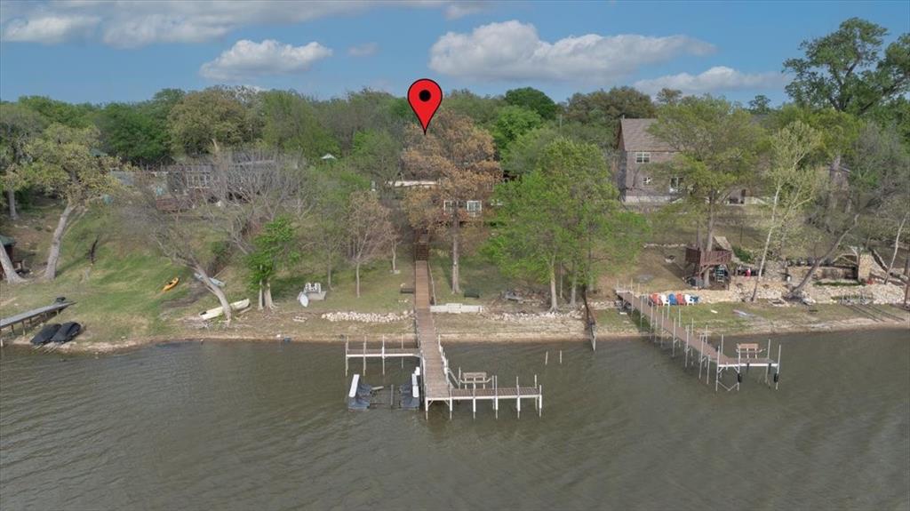 4819 Williams Spring Road Fort Worth, TX 76135 - Photo 1 of 1 a view of a swimming pool with a table and chairs