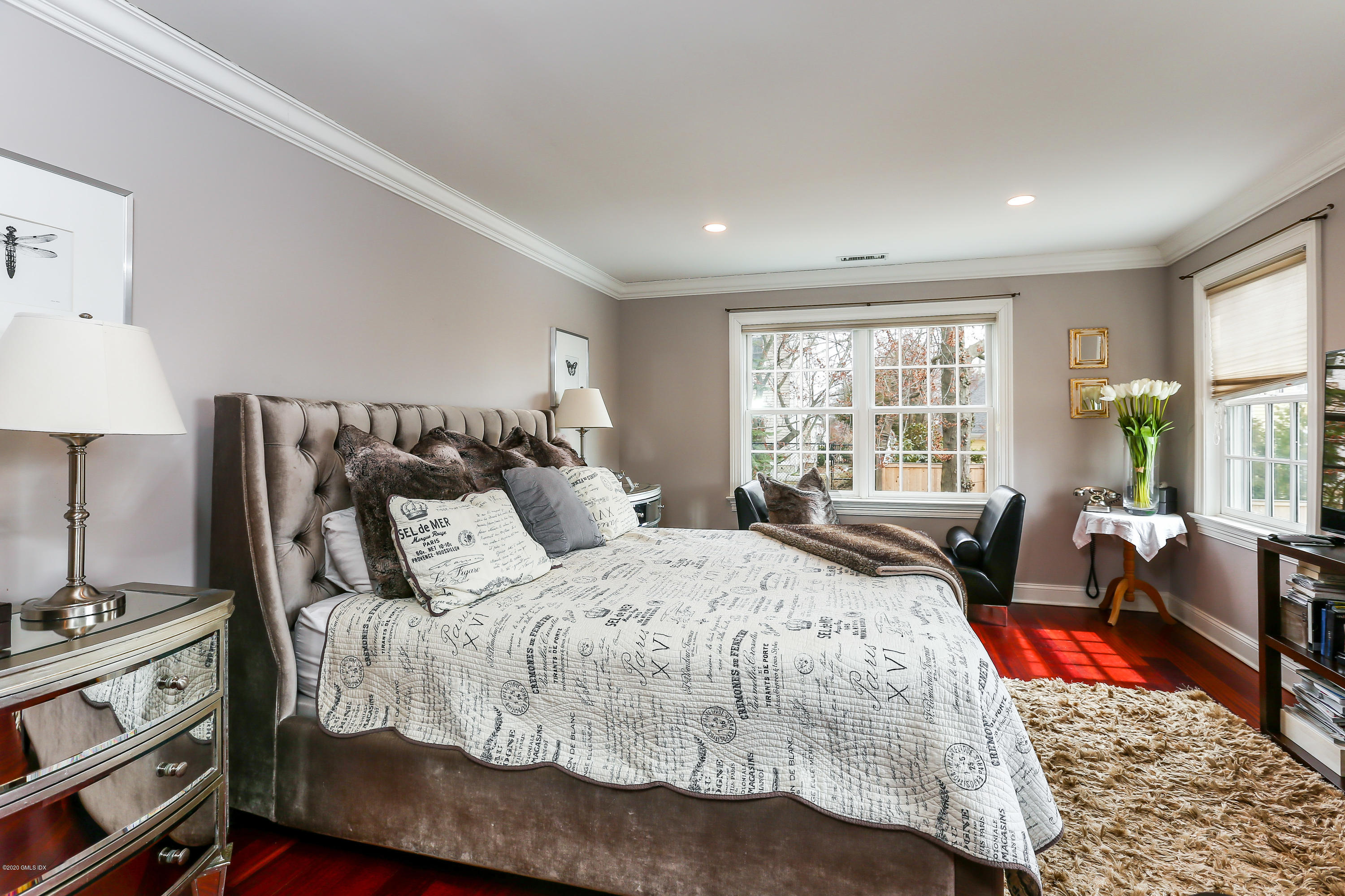 59 Riverside Lane Riverside, CT 06878 - Photo 12 of 21 a bedroom with a bed and wooden floor