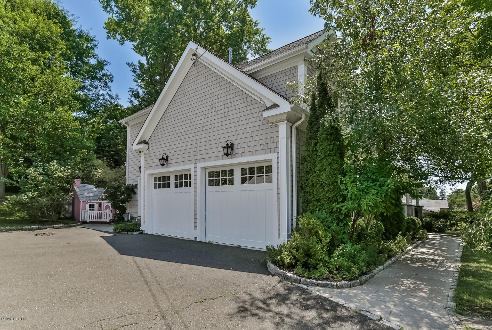 59 Riverside Lane Riverside, CT 06878 - Photo 21 of 21 a view of house with a yard and potted plants
