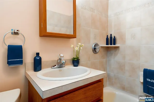 a view of a storage & utility room with two washing machine