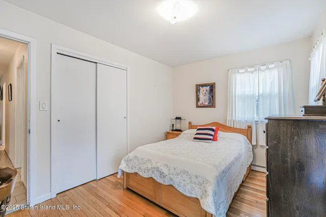 a view of a hallway with a refrigerator