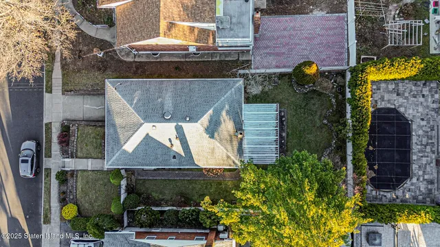 a aerial view of a house with a garden and plants
